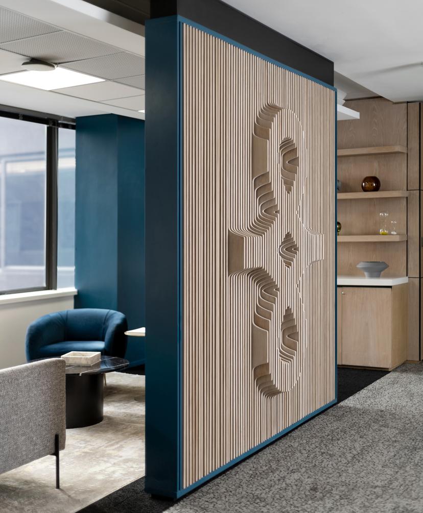 Bryte office lounge with Bryte logo on wall.